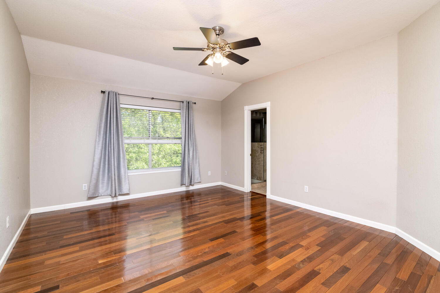 9301 Tea Rose Trail Austin, TX 78748 - Photo 20 of 36 Unfurnished room with vaulted ceiling, ceiling fan, and dark wood-style floors