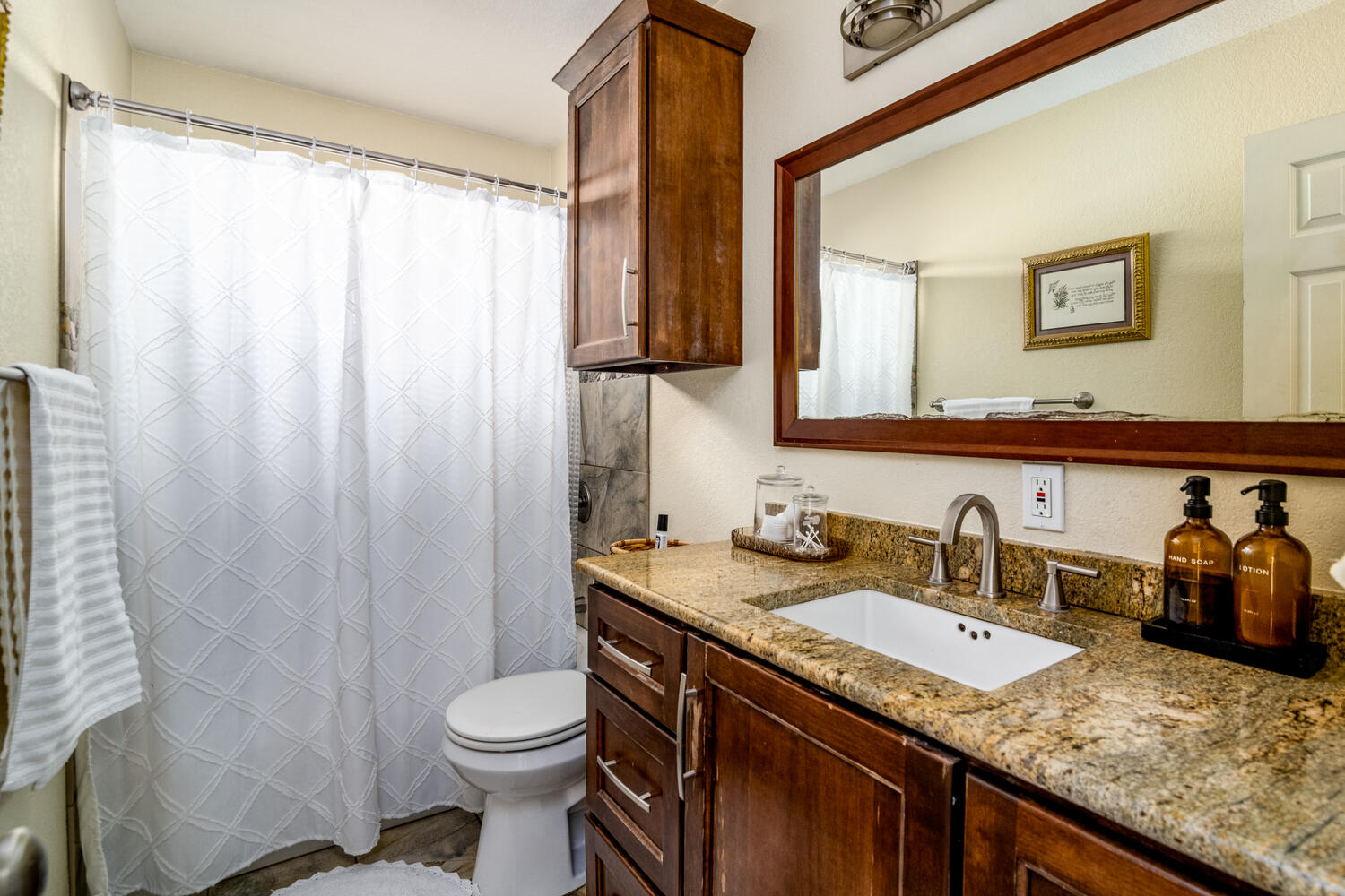 9301 Tea Rose Trail Austin, TX 78748 - Photo 25 of 36 Bathroom featuring vanity and a shower with shower curtain