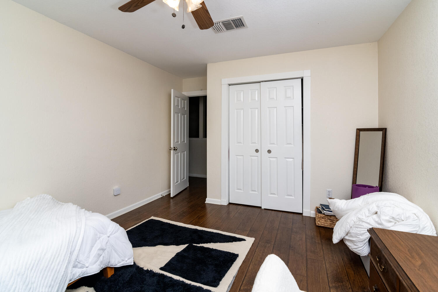 9301 Tea Rose Trail Austin, TX 78748 - Photo 30 of 36 Bedroom featuring dark wood-style floors, ceiling fan, and a closet