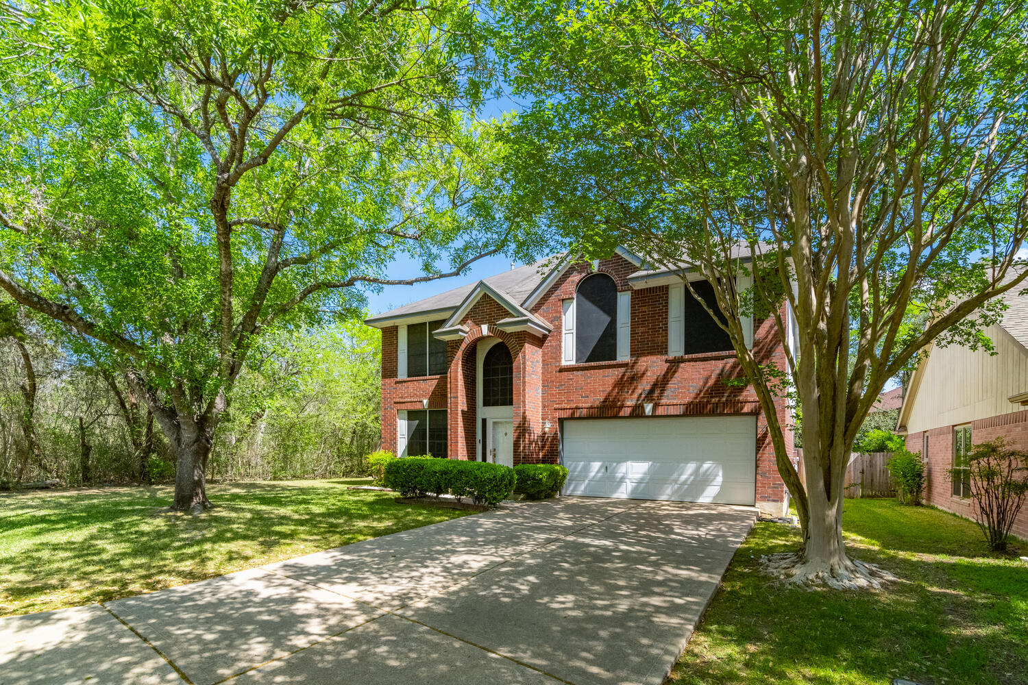 9301 Tea Rose Trail Austin, TX 78748 - Photo 3 of 36 Traditional-style house with brick siding and driveway