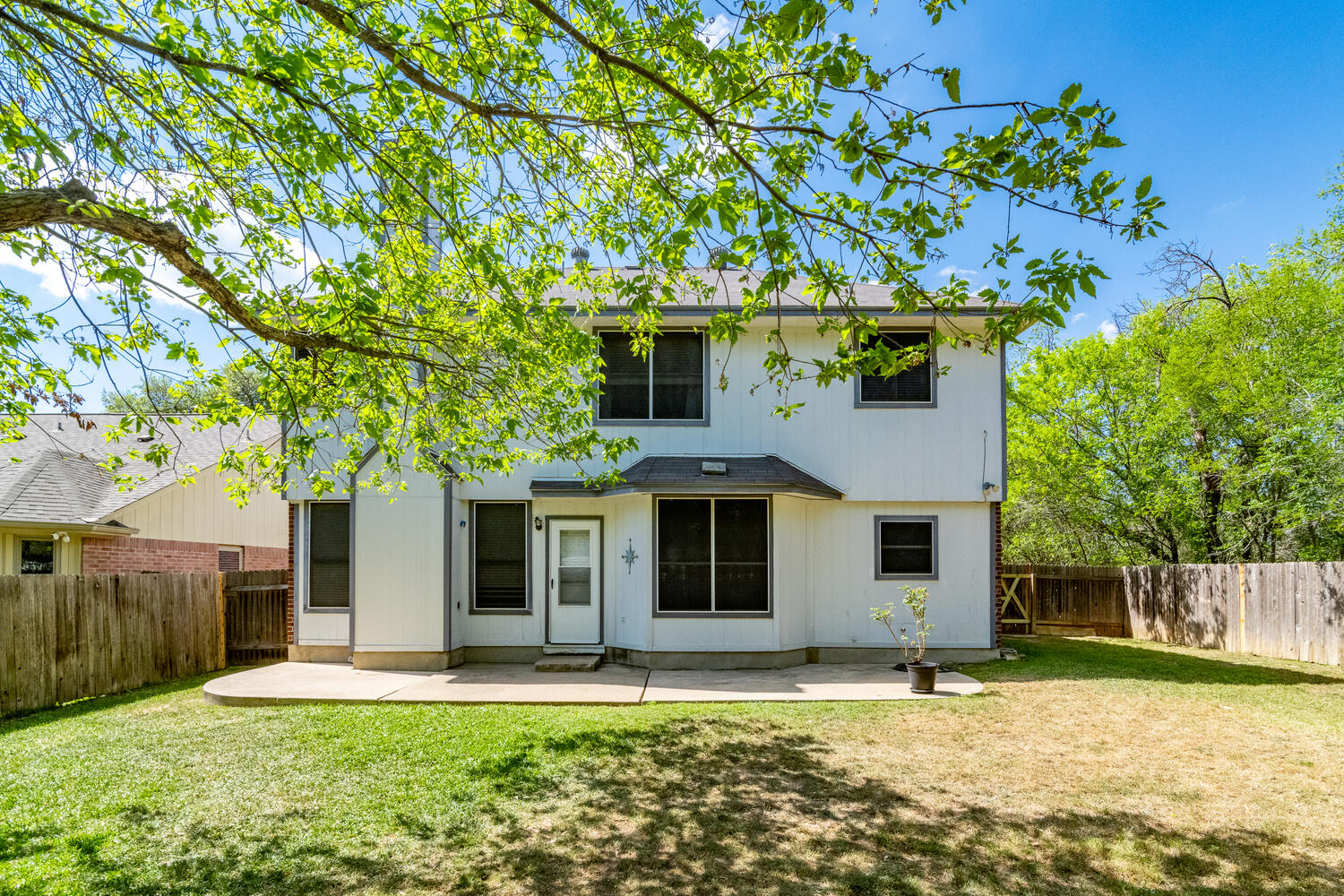 9301 Tea Rose Trail Austin, TX 78748 - Photo 31 of 36 Back of house with a fenced backyard and a patio area
