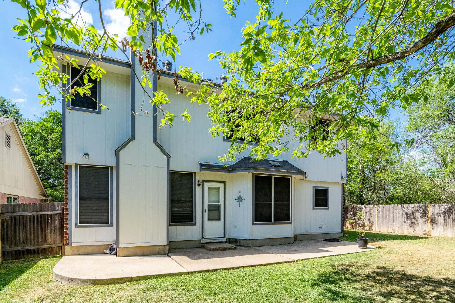 9301 Tea Rose Trail Austin, TX 78748 - Photo 33 of 36 Rear view of house featuring a fenced backyard and a patio