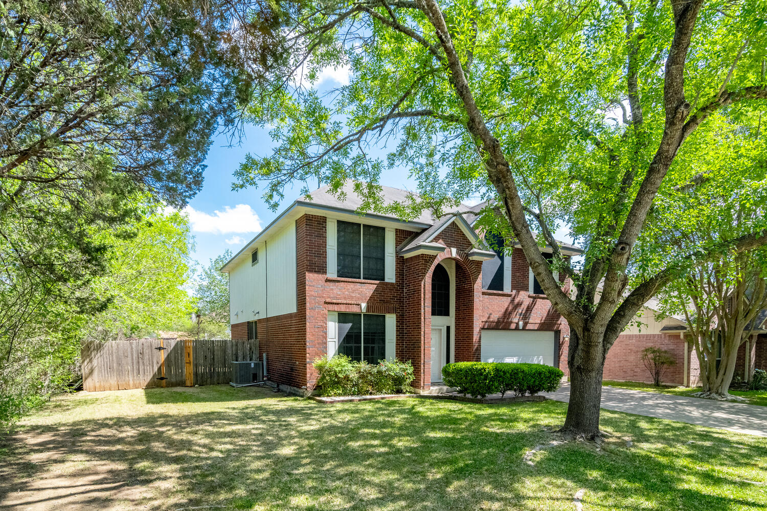9301 Tea Rose Trail Austin, TX 78748 - Photo 35 of 36 Traditional home with brick siding, a gate, and driveway