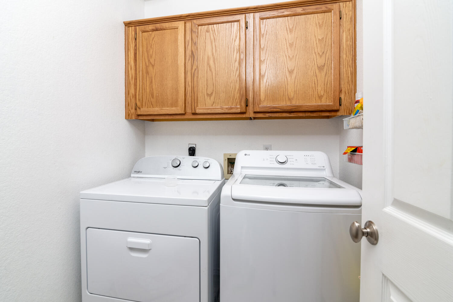 9301 Tea Rose Trail Austin, TX 78748 - Photo 36 of 36 Laundry room with cabinet space and washer and dryer