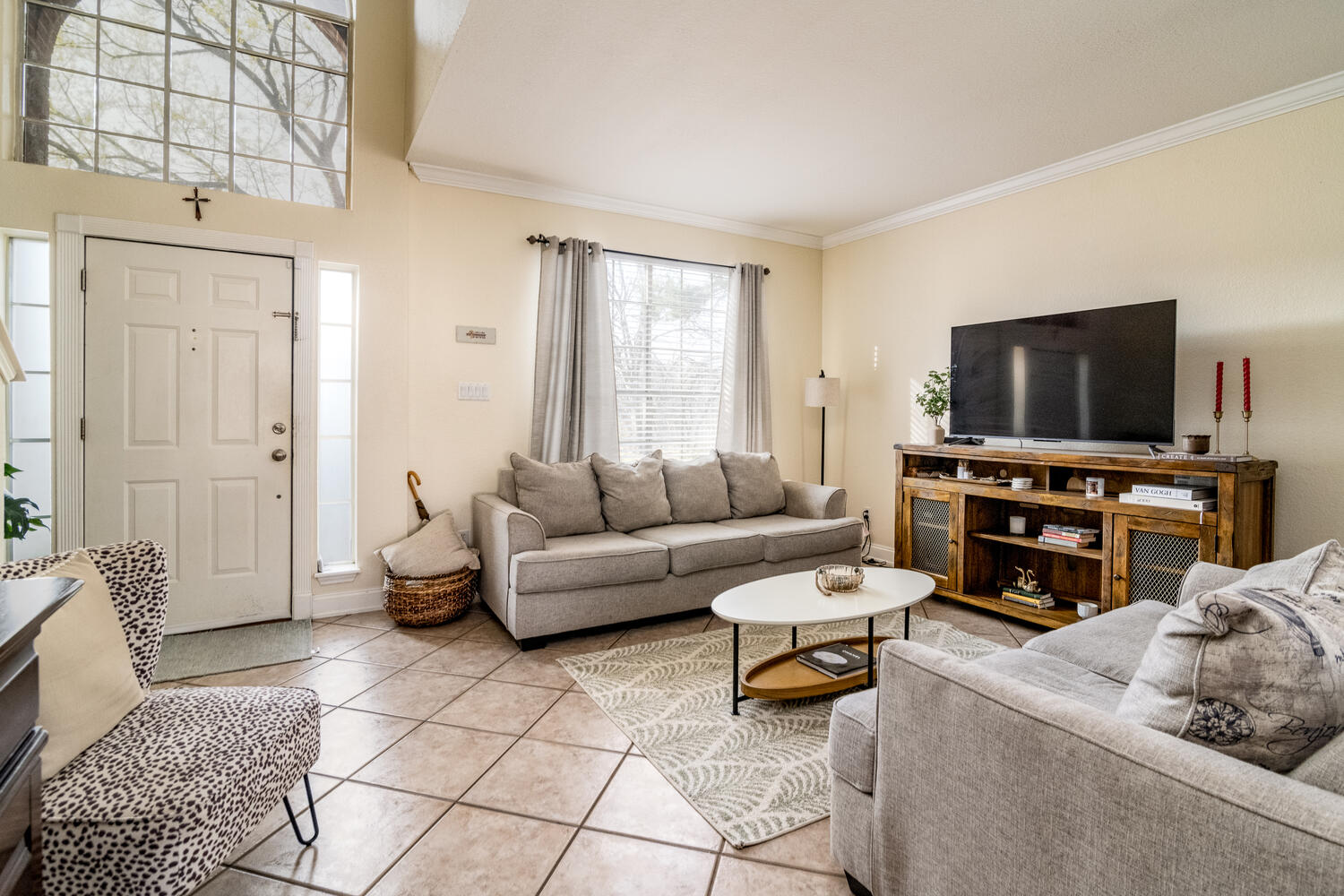 9301 Tea Rose Trail Austin, TX 78748 - Photo 6 of 36 Living area featuring crown molding and light tile patterned flooring