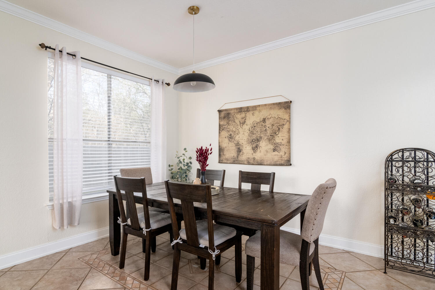9301 Tea Rose Trail Austin, TX 78748 - Photo 8 of 36 Dining space with light tile patterned floors and crown molding