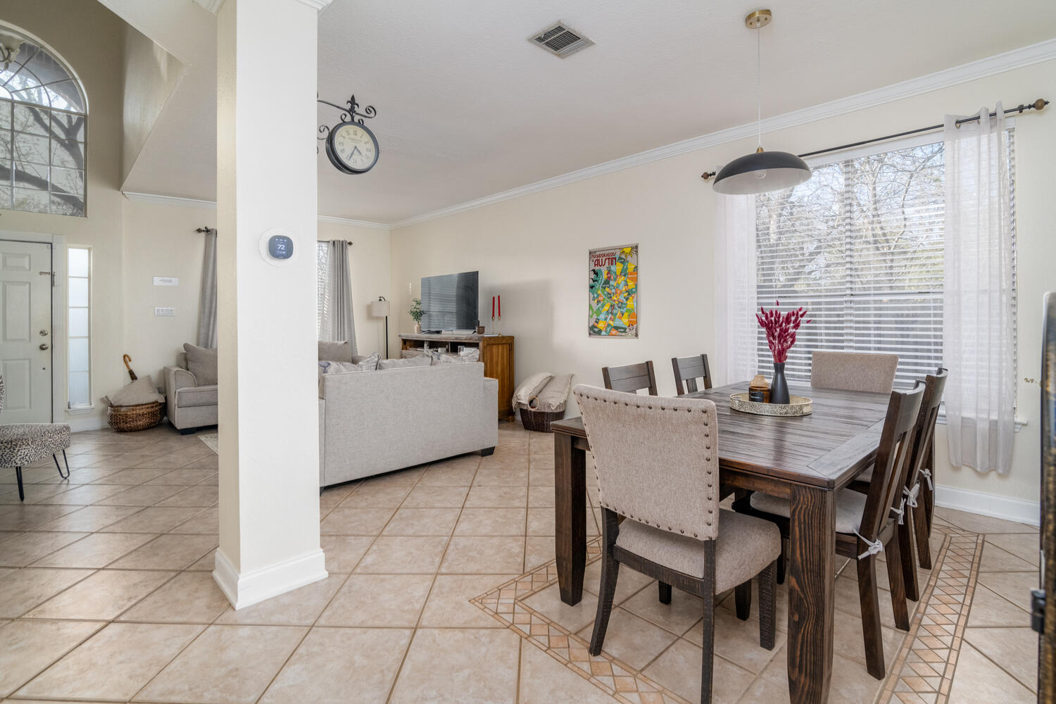 9301 Tea Rose Trail Austin, TX 78748 - Photo 9 of 36 Dining room with crown molding, light tile patterned floors, plenty of natural light, and a high ceiling