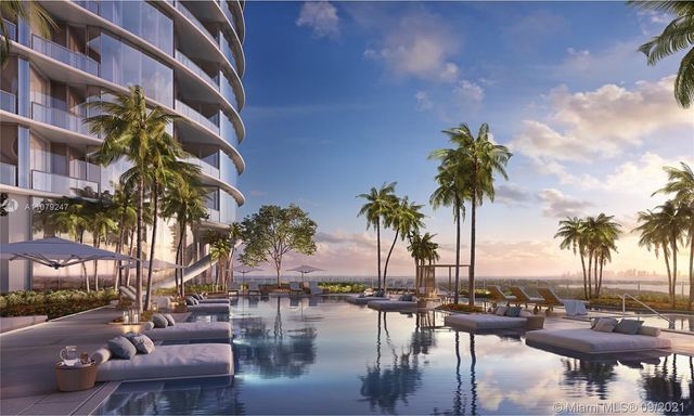 a living room with furniture a large window and wooden floor