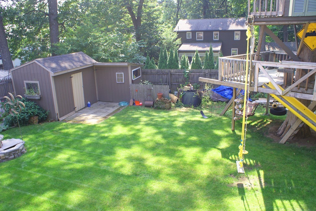 149 Endecott Street Springfield, MA 01118 - Photo 22 of 23 a view of a chair and table in backyard of the house