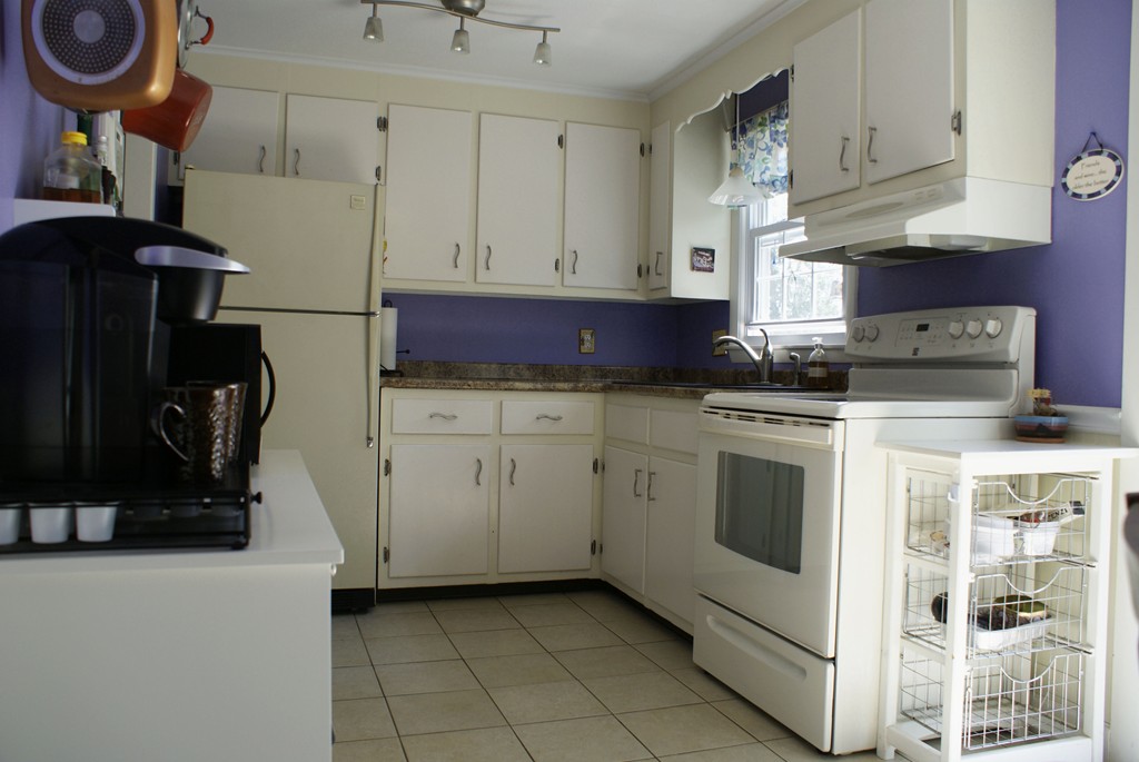 149 Endecott Street Springfield, MA 01118 - Photo 4 of 23 a kitchen with granite countertop a sink a stove and cabinets