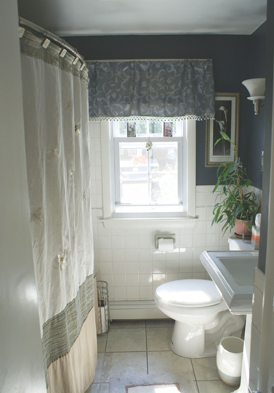 149 Endecott Street Springfield, MA 01118 - Photo 8 of 23 a bathroom with a toilet a sink and a window