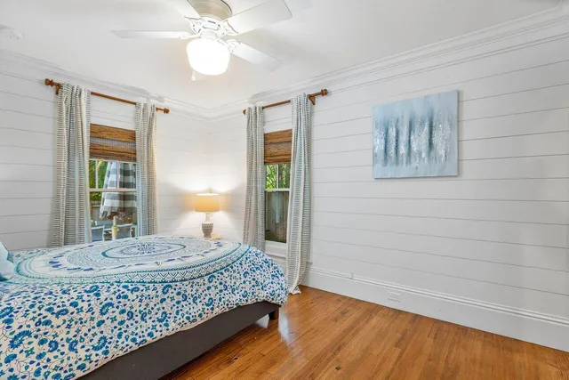 a living room with a bed and a table