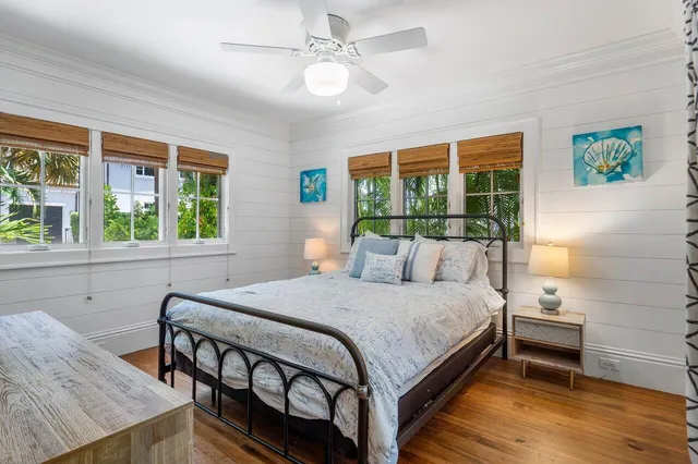 a bedroom with a bed and a table