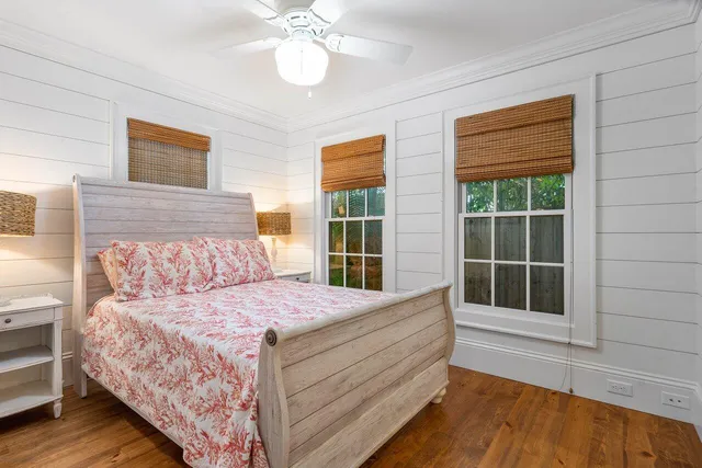 a bedroom with a large bed and a window