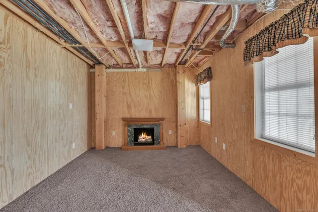 a view of white house with a yard