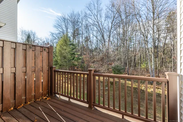 a view of balcony with wooden floor