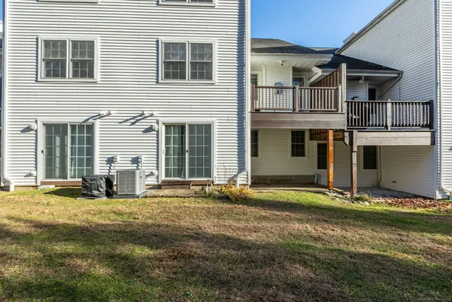 a view of house with backyard of house