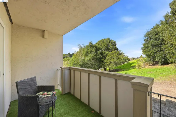 a view of a swimming pool and an outdoor seating