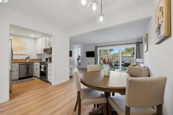 a dining room with furniture and window