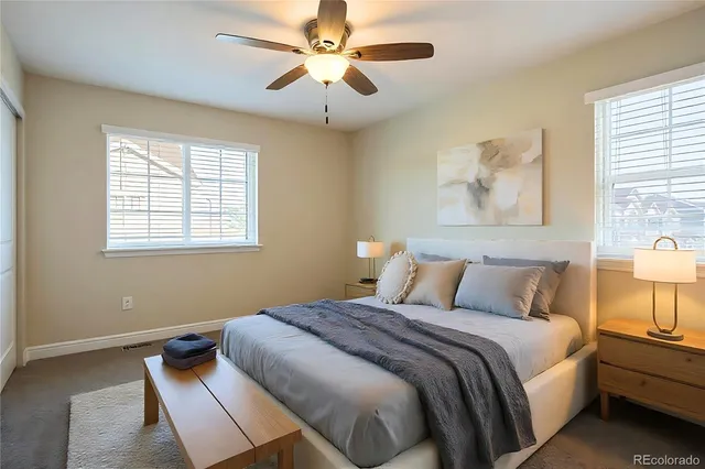 a bathroom with a sink a vanity and a large mirror