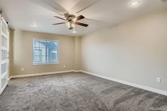 a view of a house with a small yard and plants