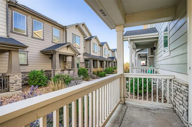 a view of house with outdoor space and parking area