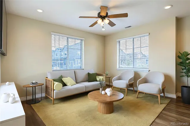 a living room with furniture and a window