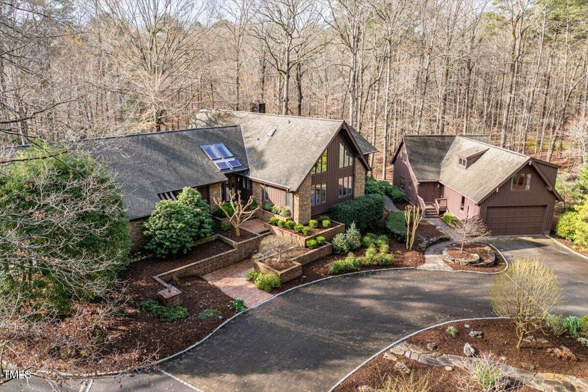10729 Trego Trail Raleigh, NC 27614 - Photo 2 of 65 Property features a spacious, well-designed detached 5-car garage with an apartment suite above.