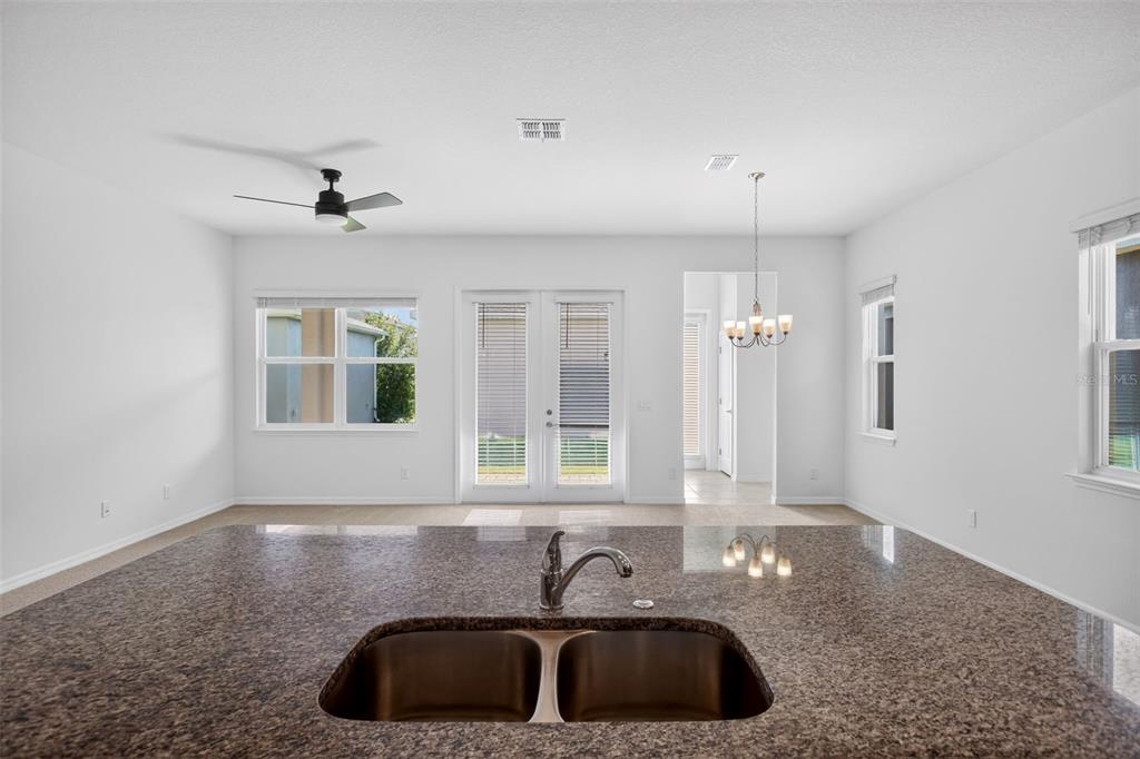 810 MIDDLETON Street DeBary, FL 32713 - Photo 12 of 52 a kitchen with granite countertop a sink and a window