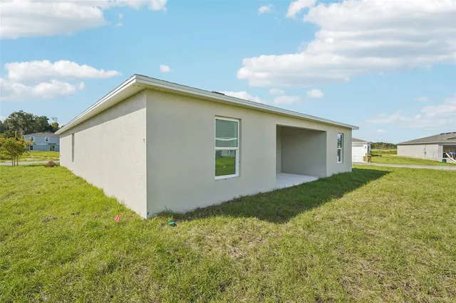 a view of a backyard of the house