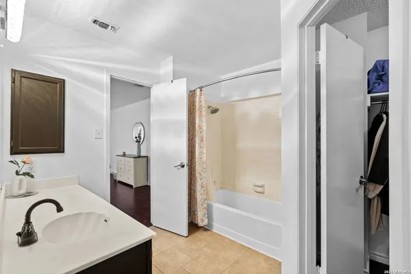 a bathroom with a sink and a shower