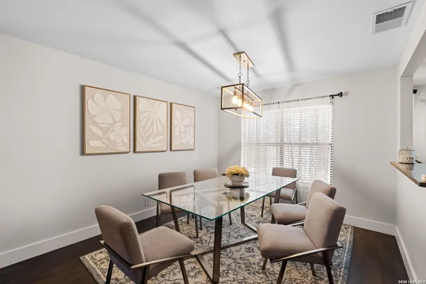 a view of a dining room with furniture window and wooden floor