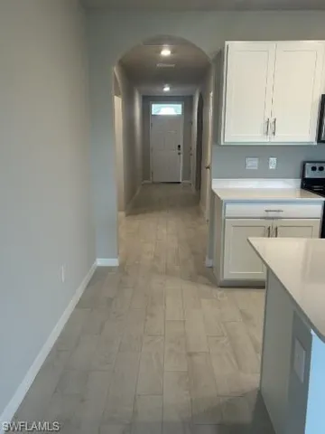 a view of a kitchen with electric appliances