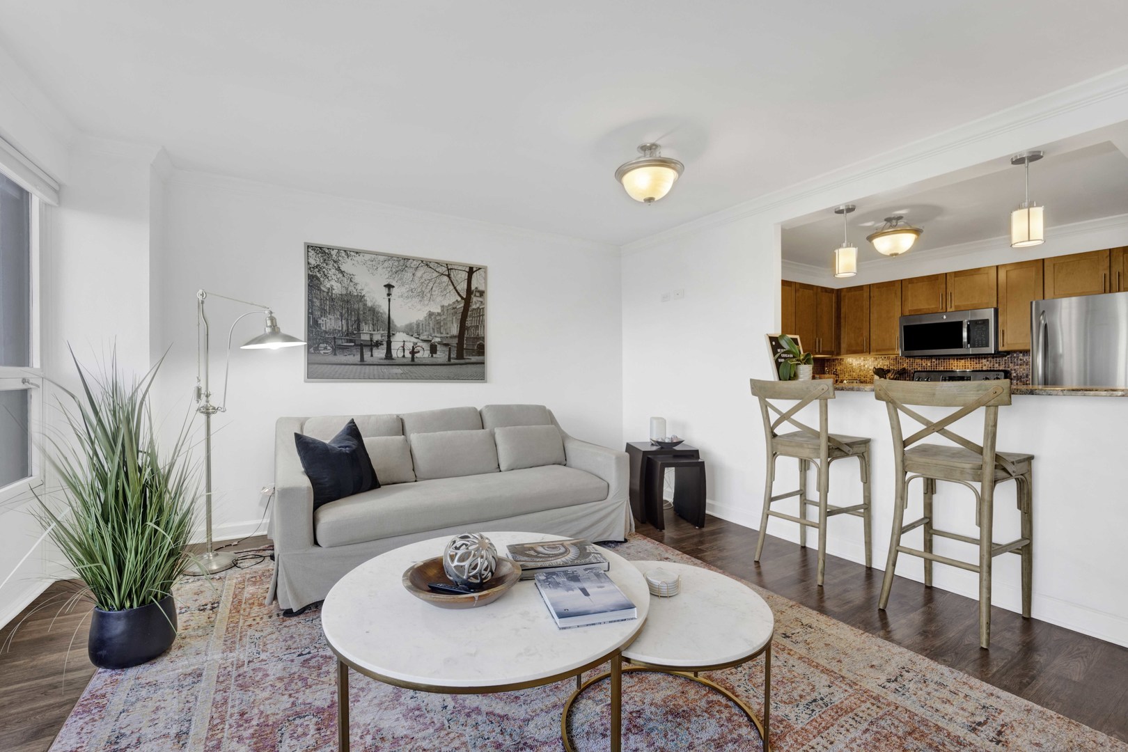 30 East Huron Street, Unit 3206 Chicago, IL 60611 - Photo 4 of 29 a living room with furniture and kitchen view