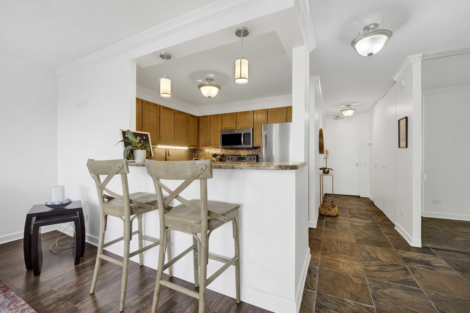 30 East Huron Street, Unit 3206 Chicago, IL 60611 - Photo 7 of 29 a view of a dining room with furniture and a chandelier