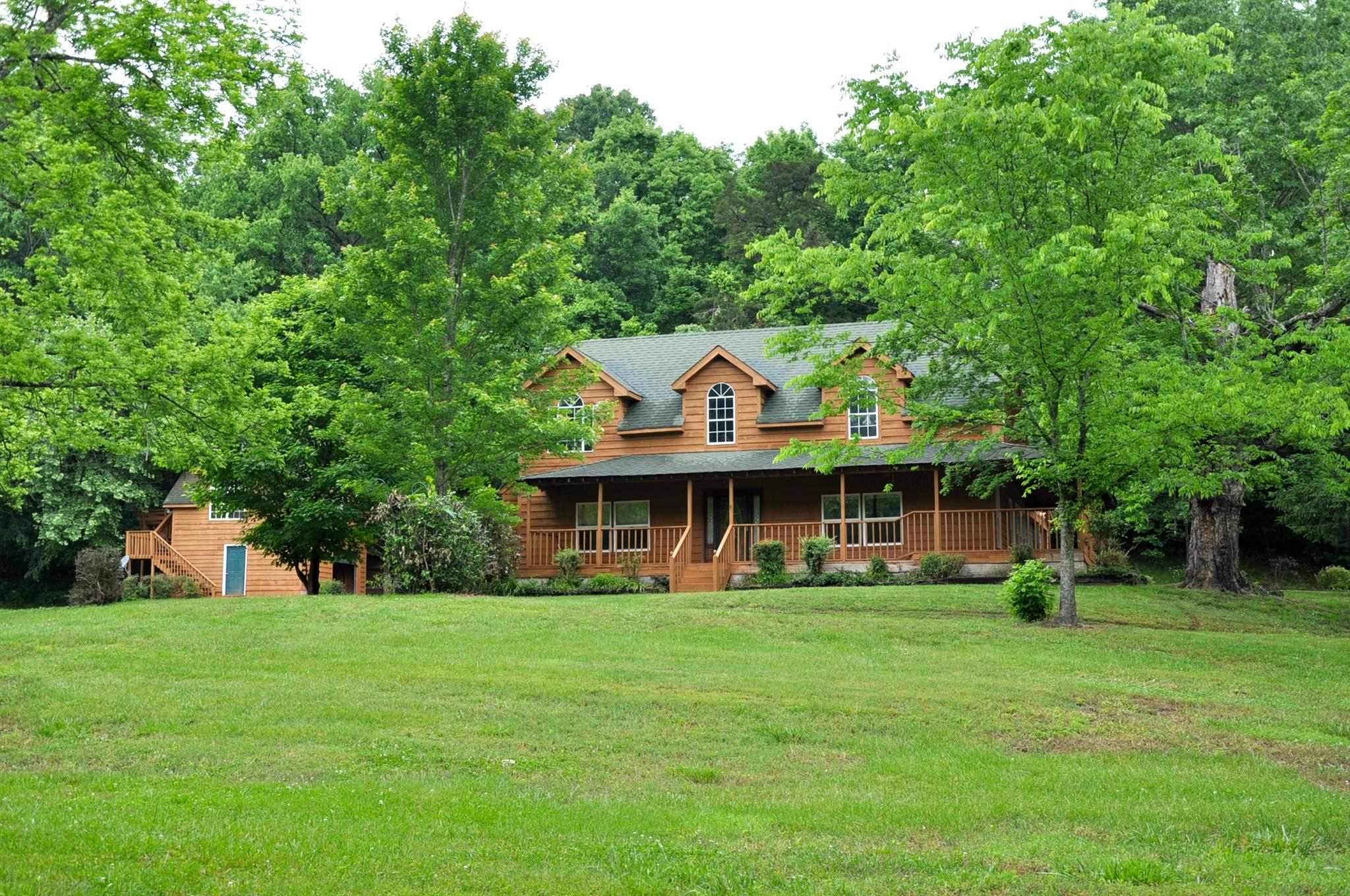 8013 Mill Road Cross Plains, TN 37049 - Photo 1 of 26 a front view of house with a garden