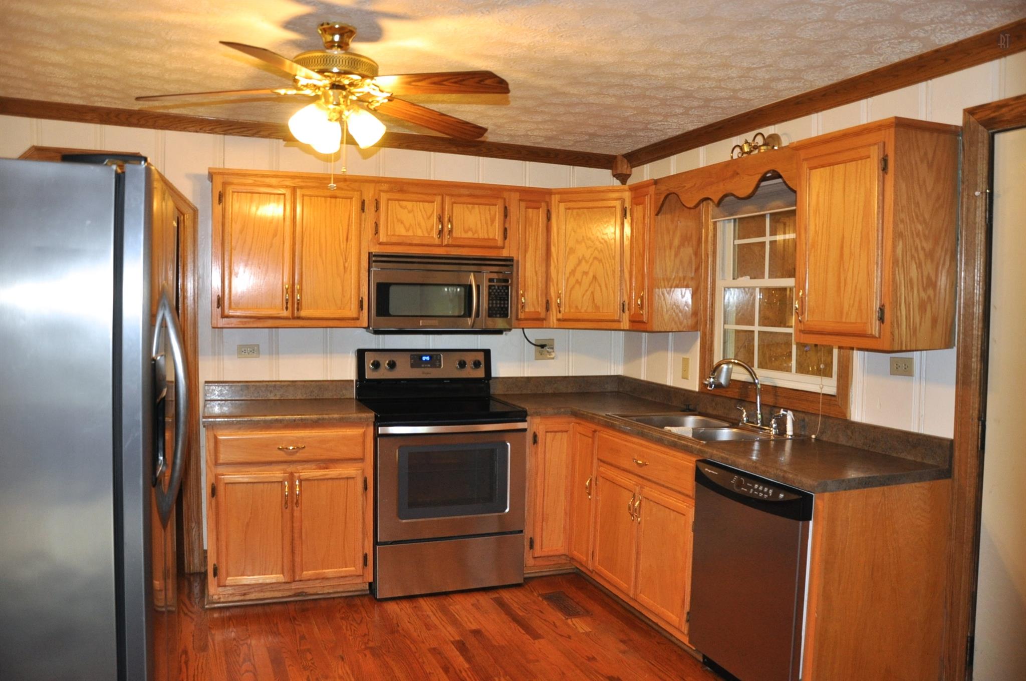 8013 Mill Road Cross Plains, TN 37049 - Photo 13 of 26 a kitchen with a sink appliances and cabinets