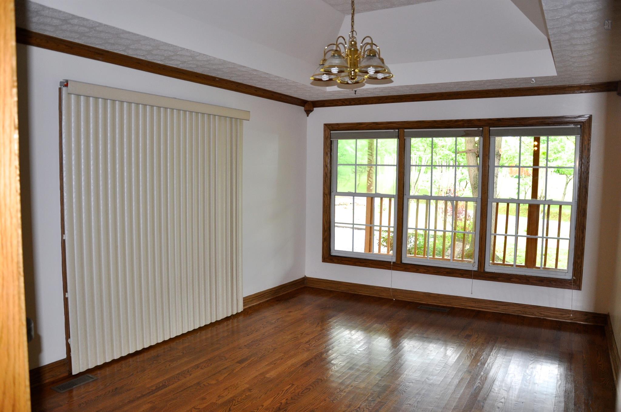 8013 Mill Road Cross Plains, TN 37049 - Photo 14 of 26 a view of an empty room with wooden floor and a window