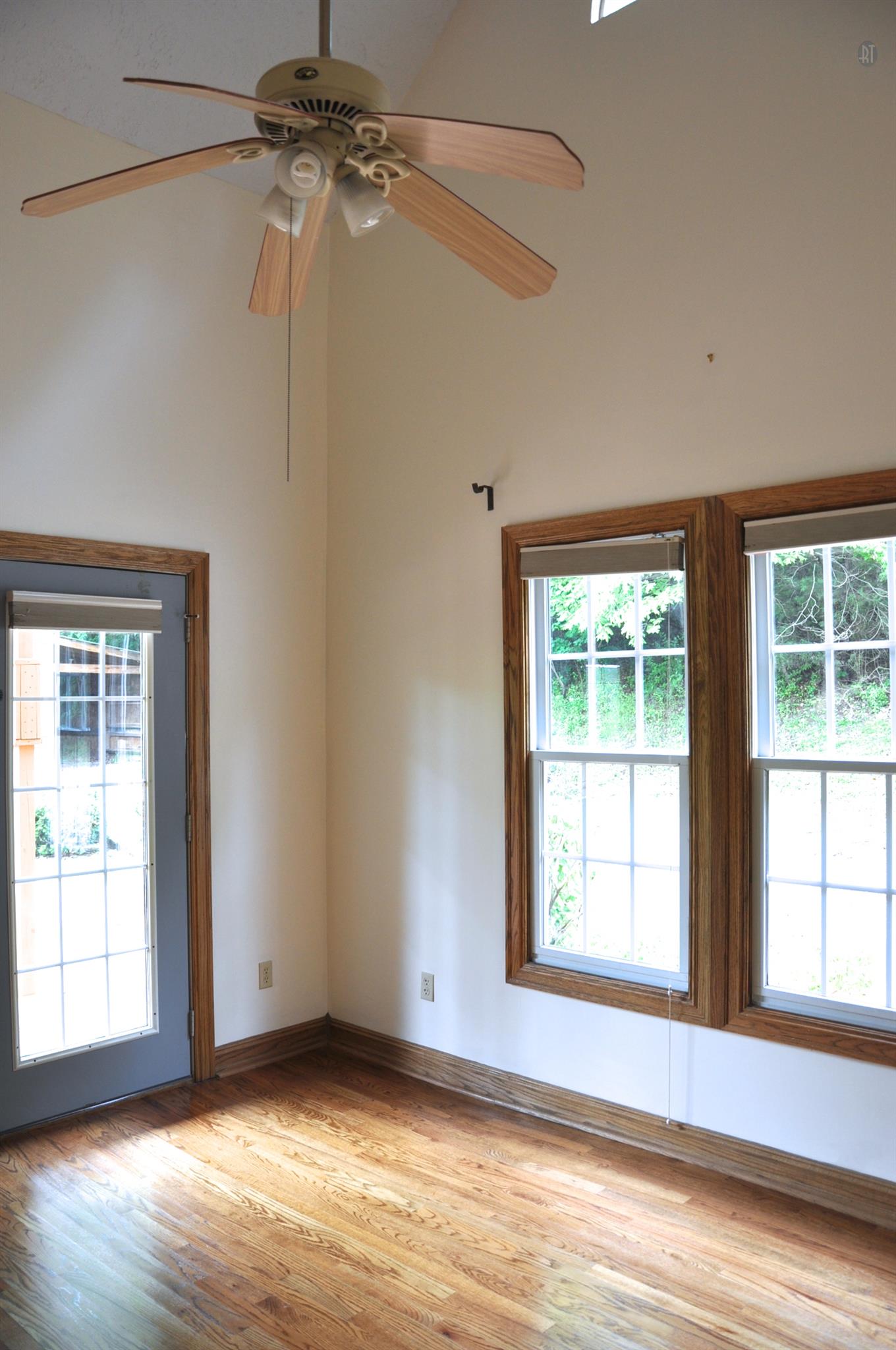 8013 Mill Road Cross Plains, TN 37049 - Photo 16 of 26 a view of an empty room with wooden floor and a window