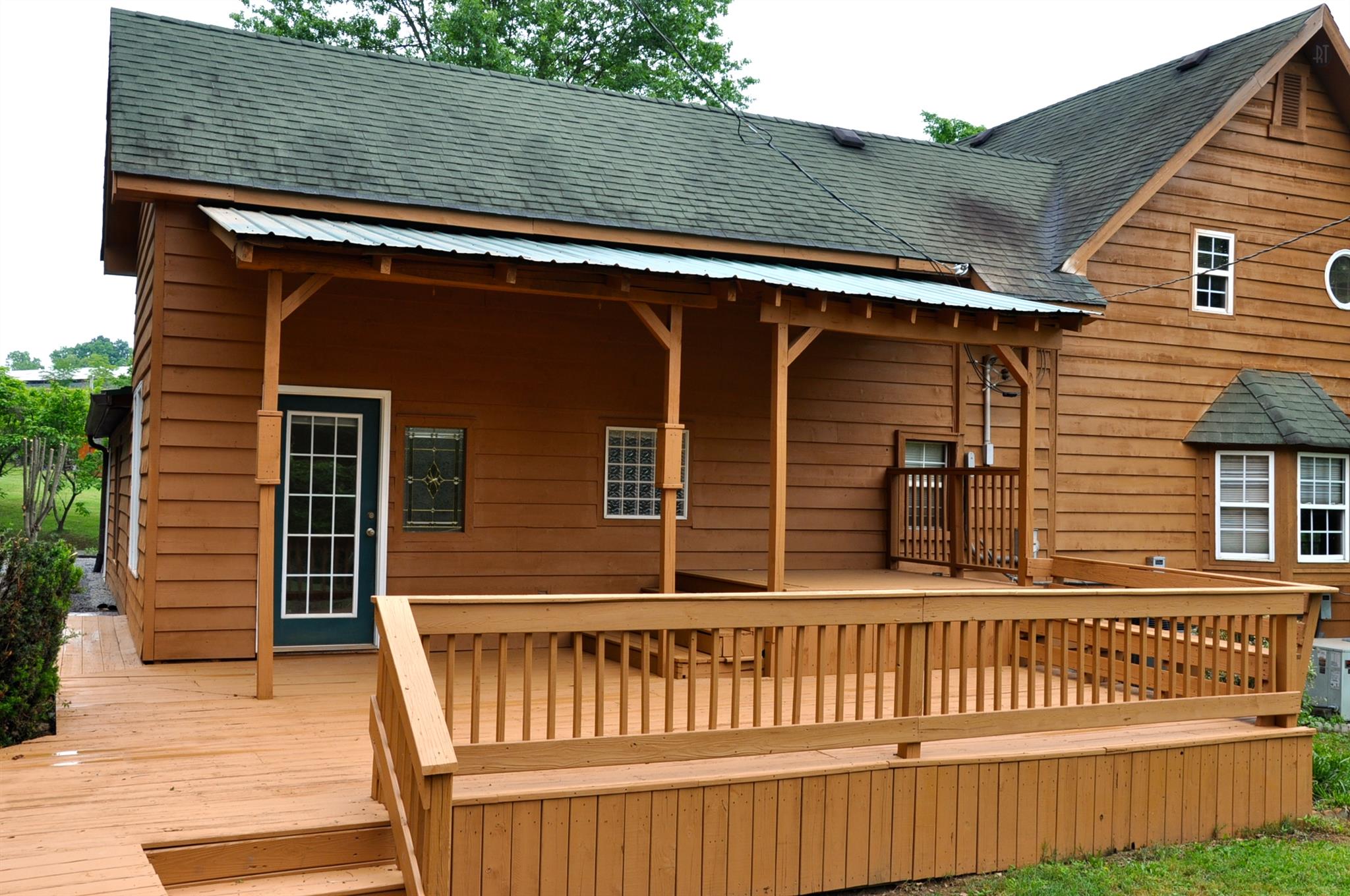 8013 Mill Road Cross Plains, TN 37049 - Photo 8 of 26 a view of a house with a wooden deck