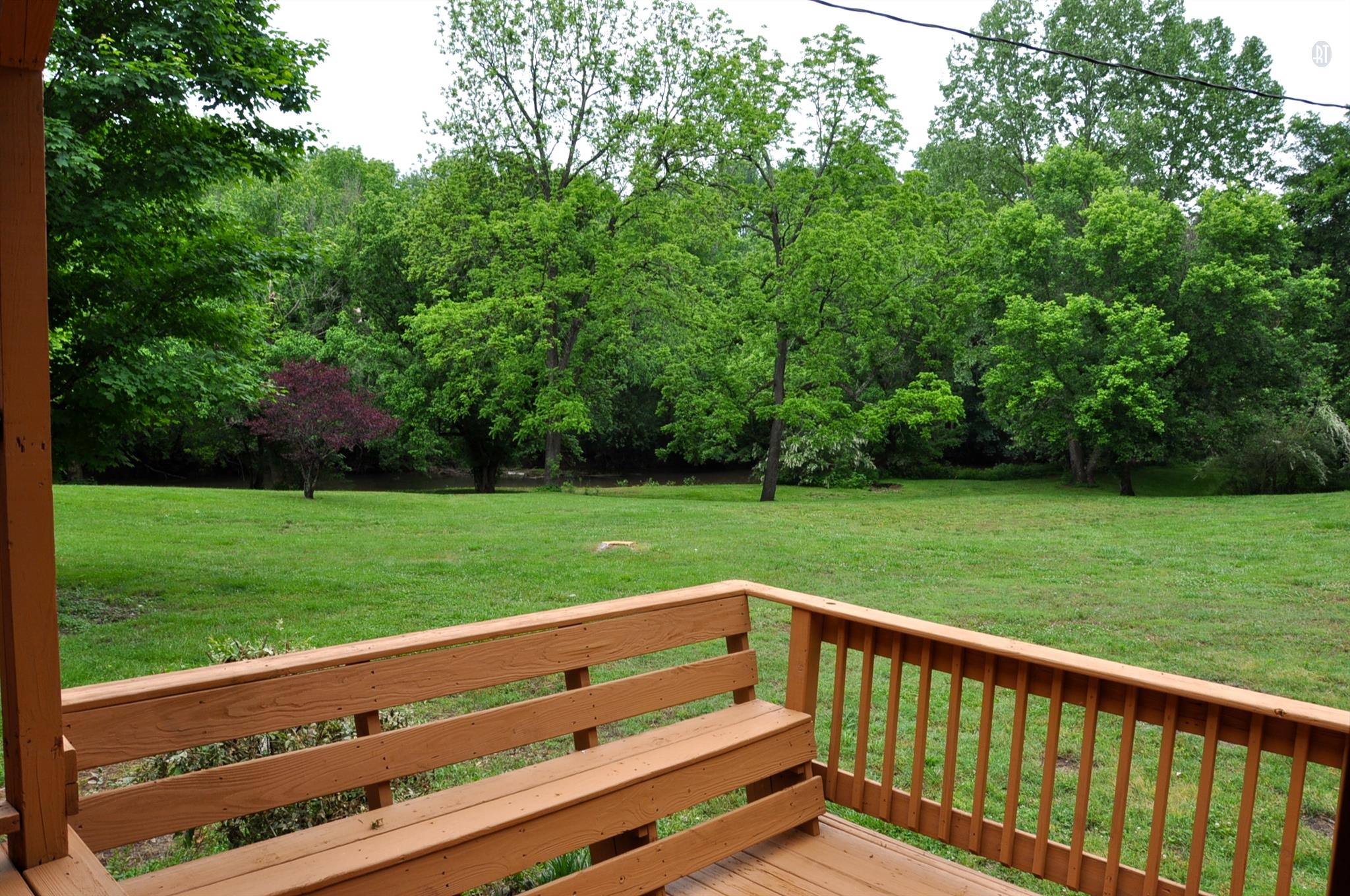 8013 Mill Road Cross Plains, TN 37049 - Photo 9 of 26 a view of a wooden bench and trees in the park