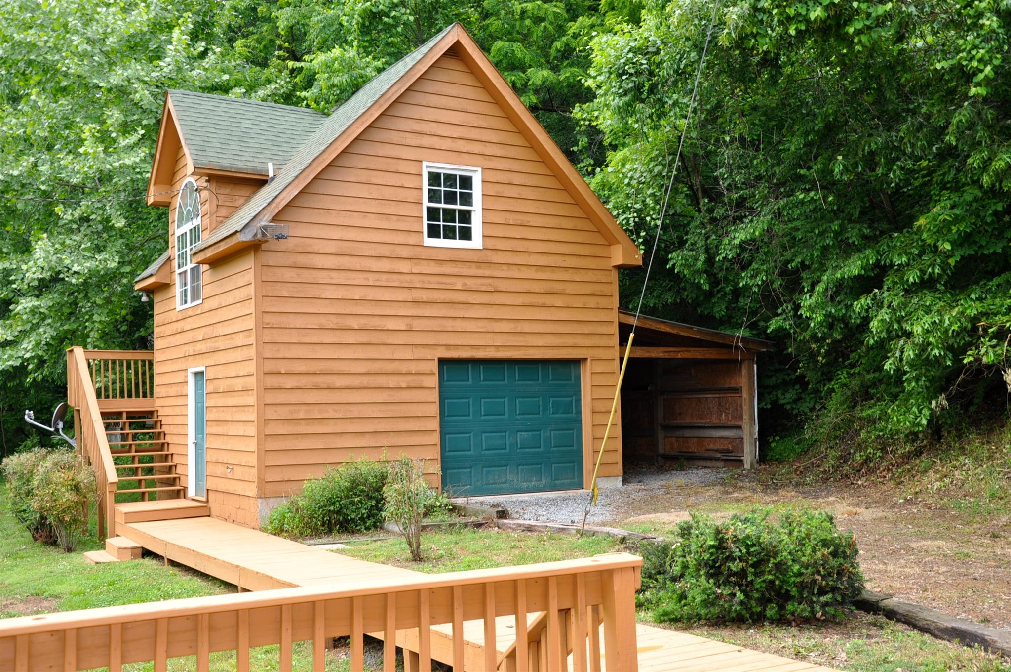 8013 Mill Road Cross Plains, TN 37049 - Photo 10 of 26 a view of house with backyard and garden