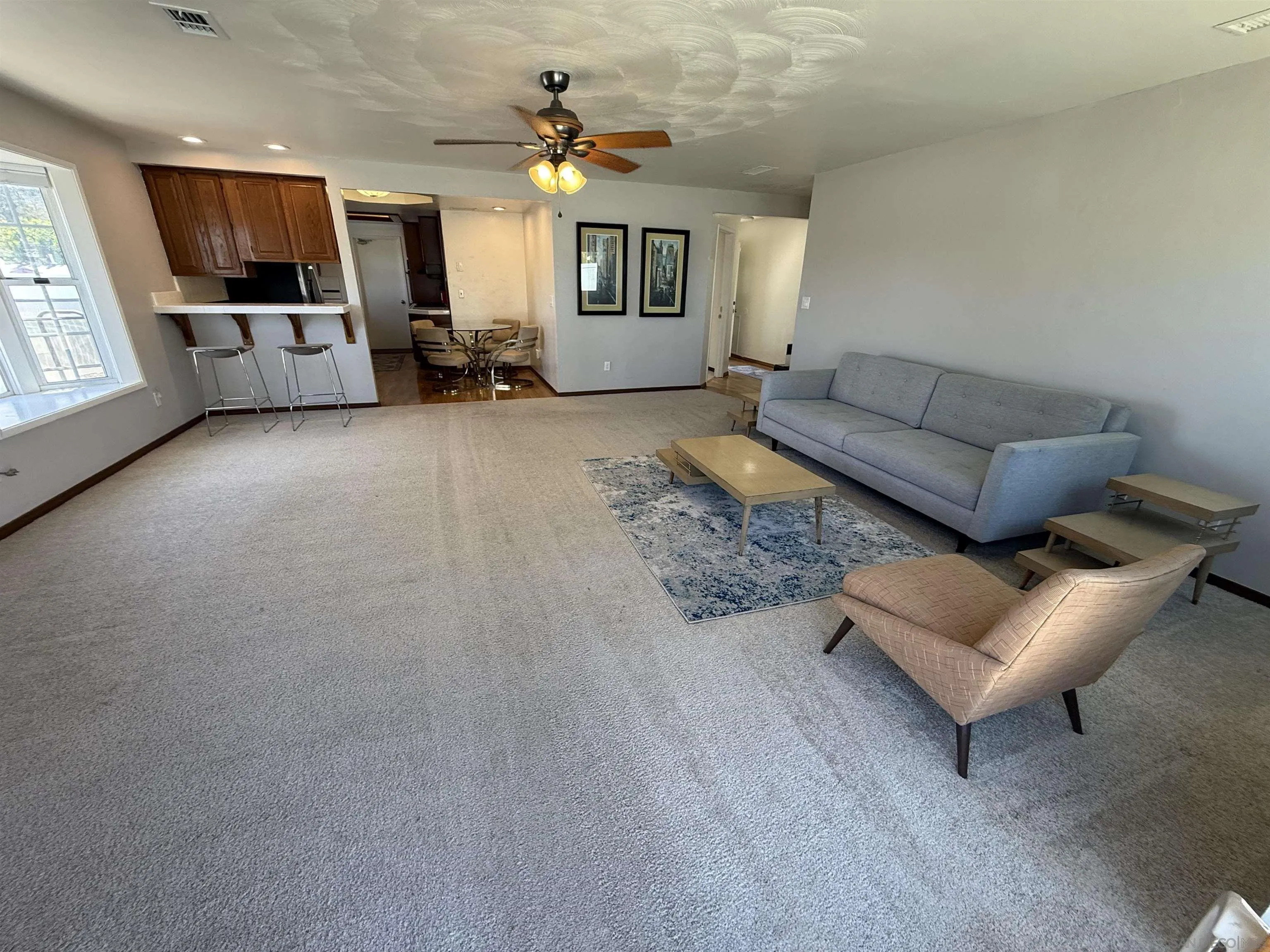 7902 Poplin Drive Santee, CA 92071 - Photo 14 of 59 a living room with furniture and a flat screen tv