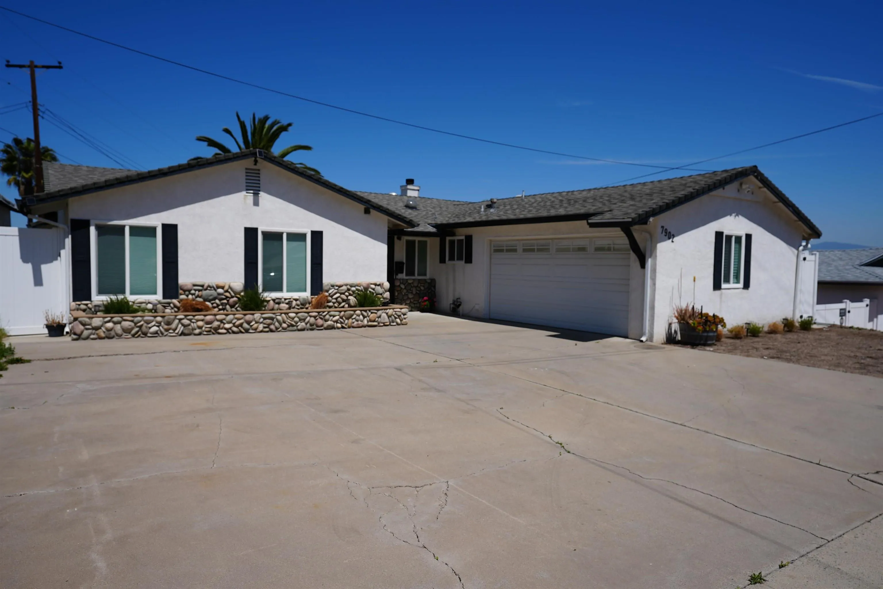 7902 Poplin Drive Santee, CA 92071 - Photo 2 of 59 a front view of a house with a yard