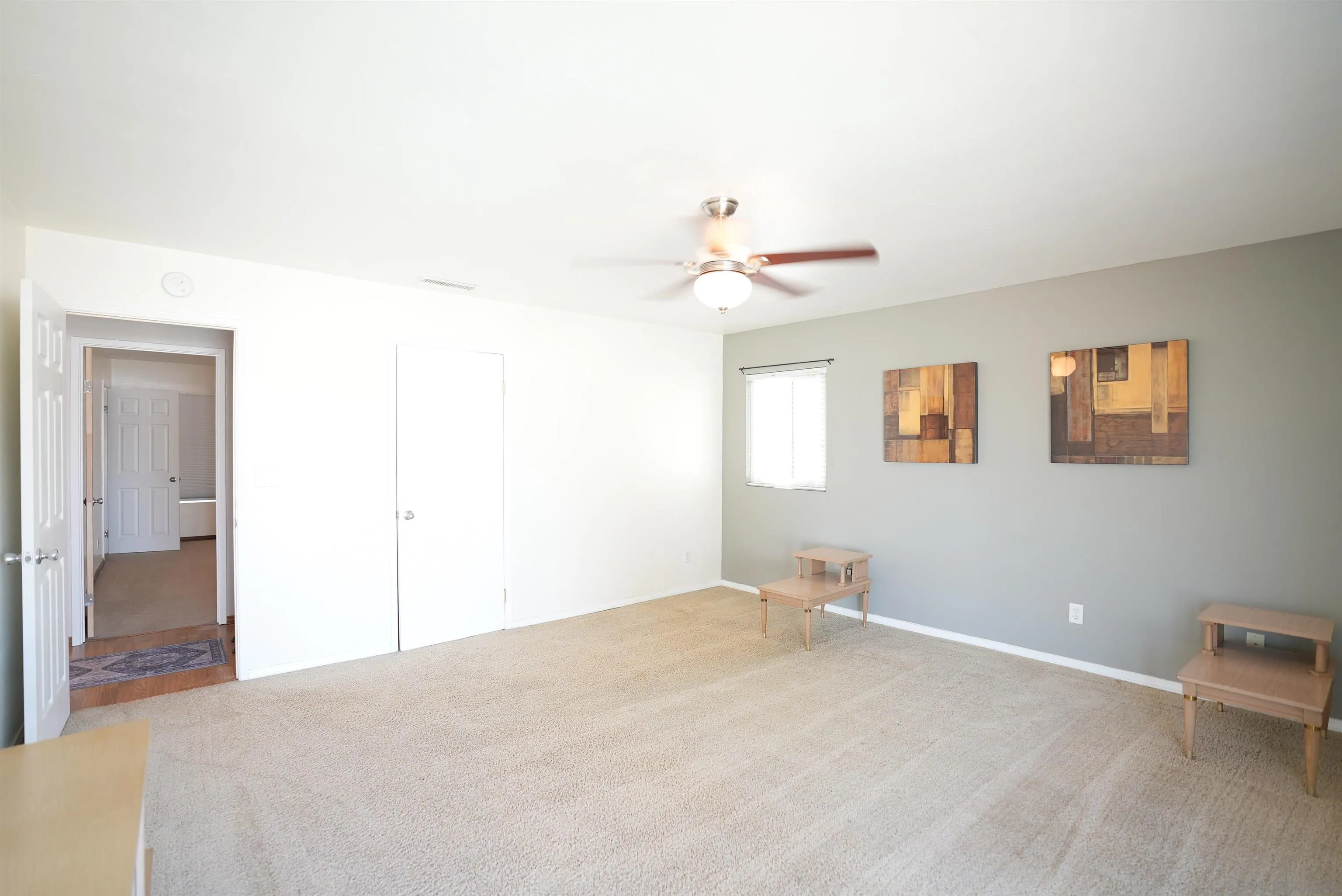 7902 Poplin Drive Santee, CA 92071 - Photo 26 of 59 a bedroom with a bed and a chandelier