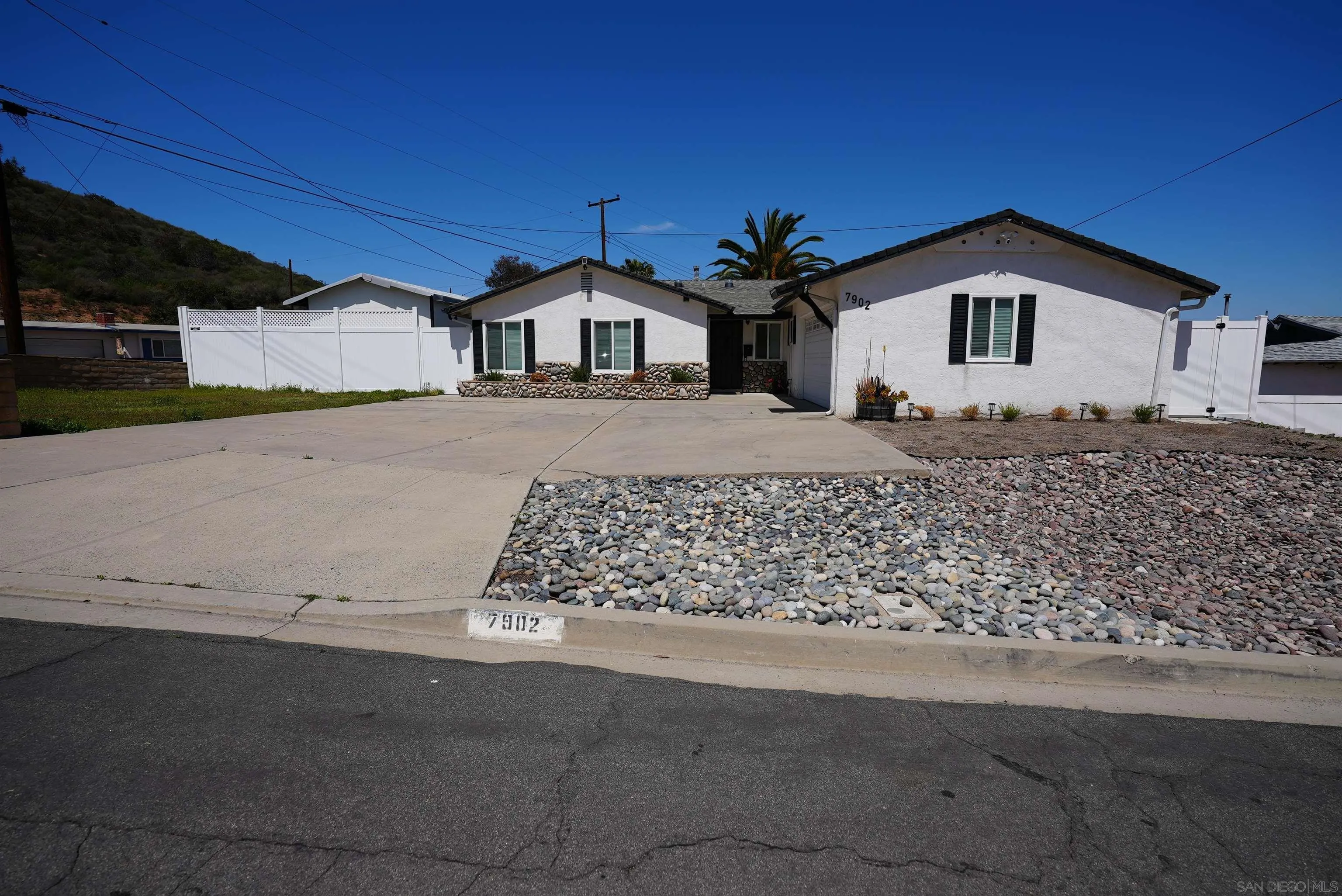 7902 Poplin Drive Santee, CA 92071 - Photo 3 of 59 a front view of a house with a yard