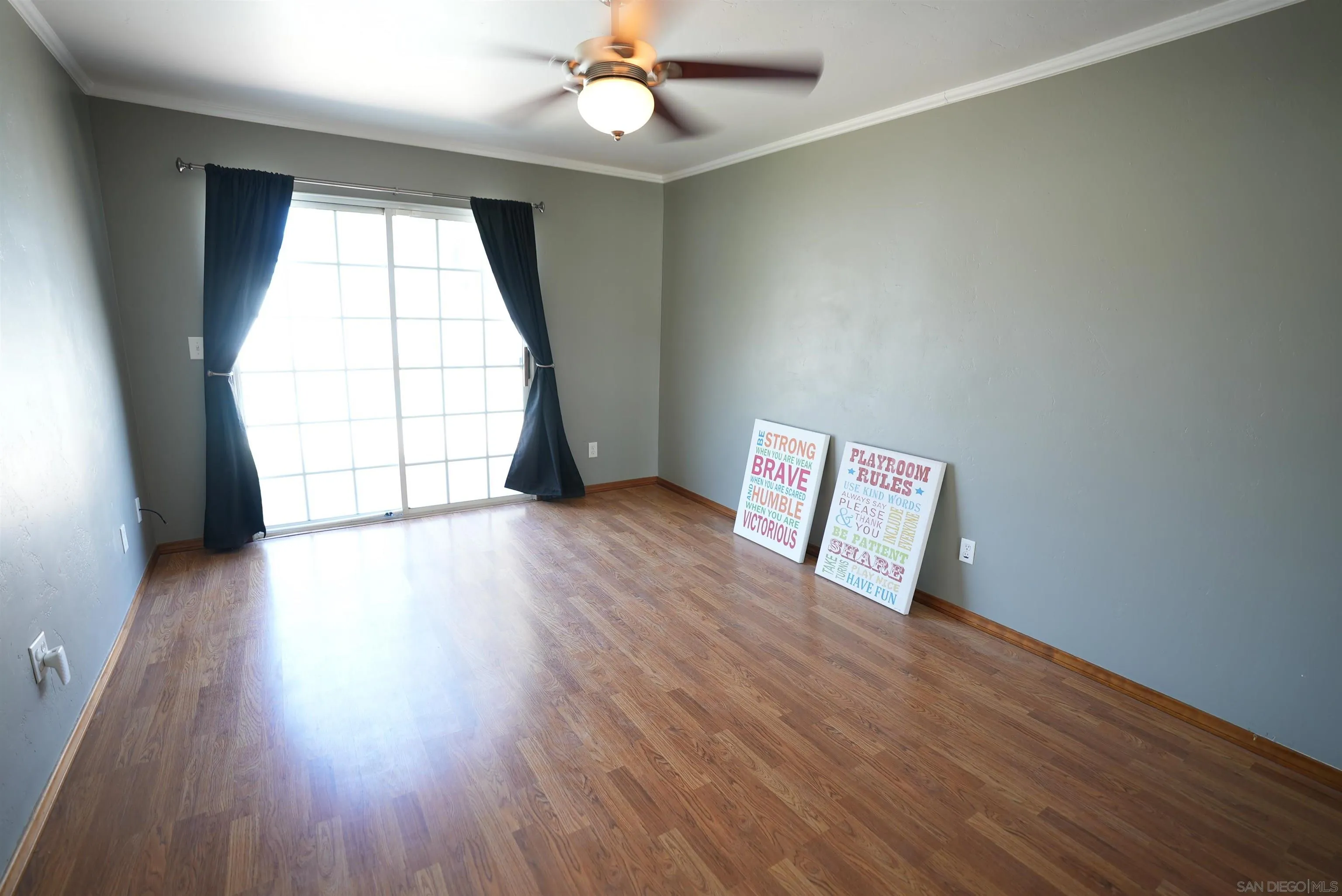 7902 Poplin Drive Santee, CA 92071 - Photo 33 of 59 an empty room with wooden floor and windows
