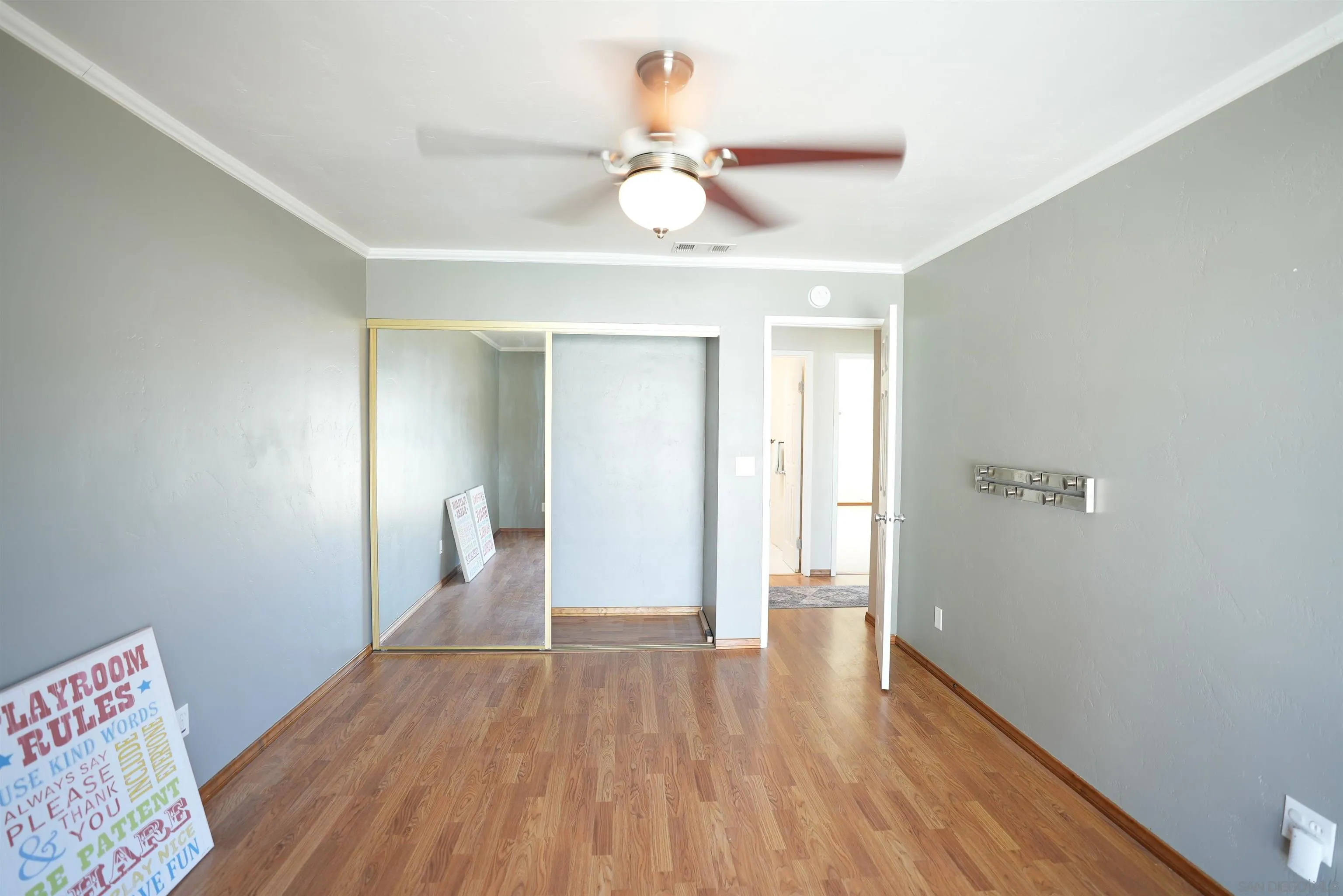 7902 Poplin Drive Santee, CA 92071 - Photo 34 of 59 a view of an empty room with wooden floor and a window