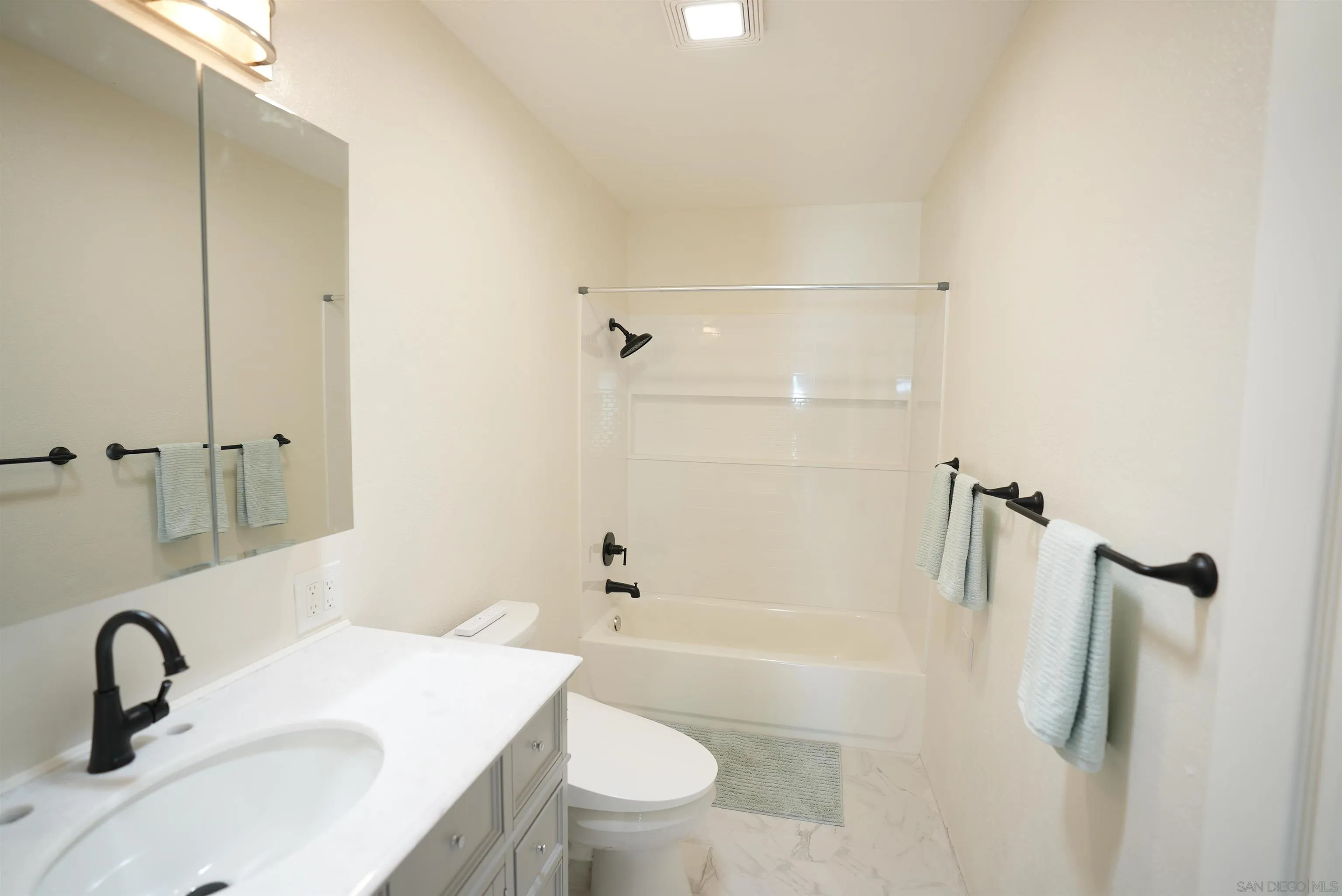 7902 Poplin Drive Santee, CA 92071 - Photo 35 of 59 a bathroom with a sink toilet and shower