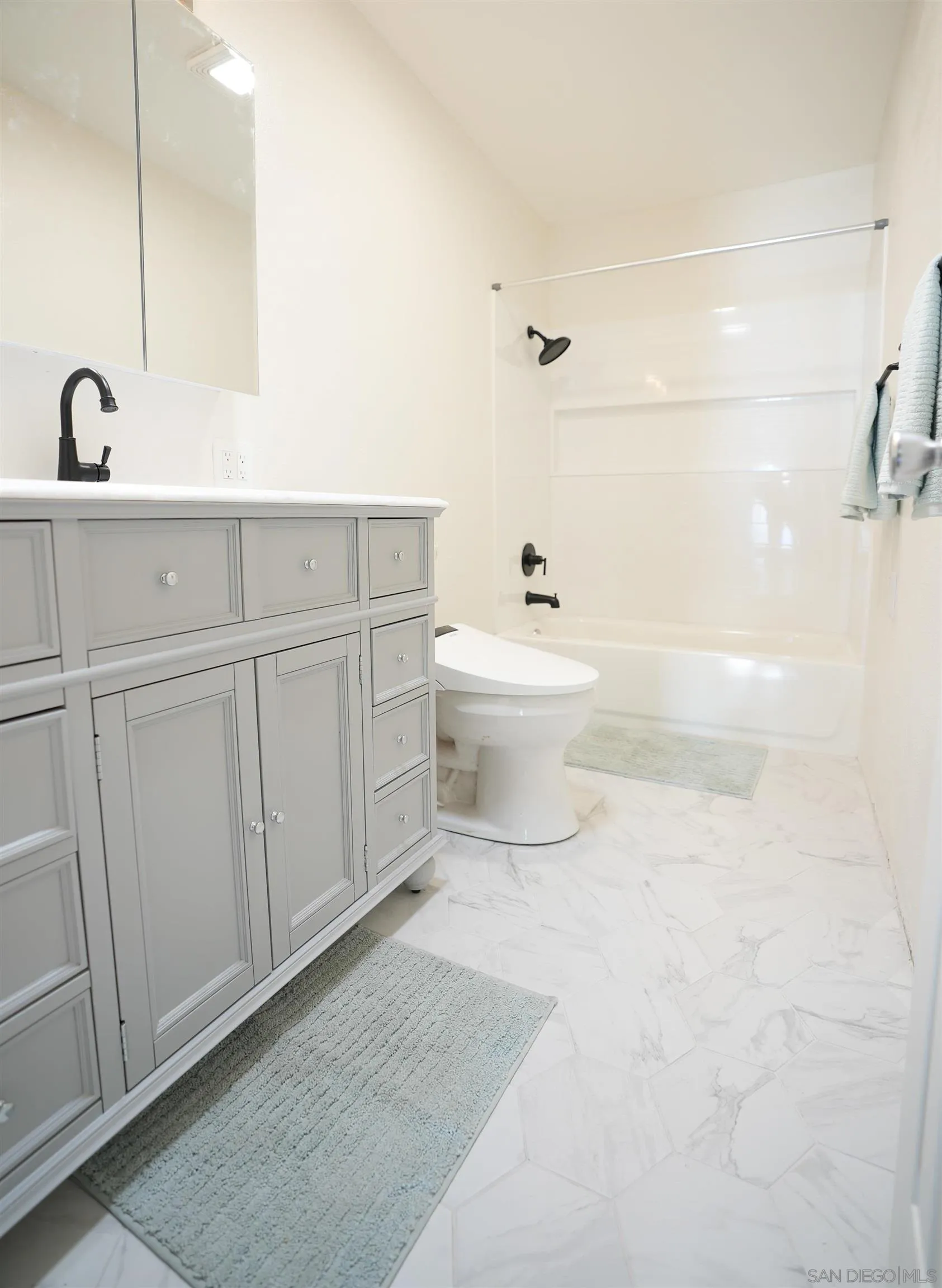 7902 Poplin Drive Santee, CA 92071 - Photo 40 of 59 a bathroom with a sink a toilet and mirror
